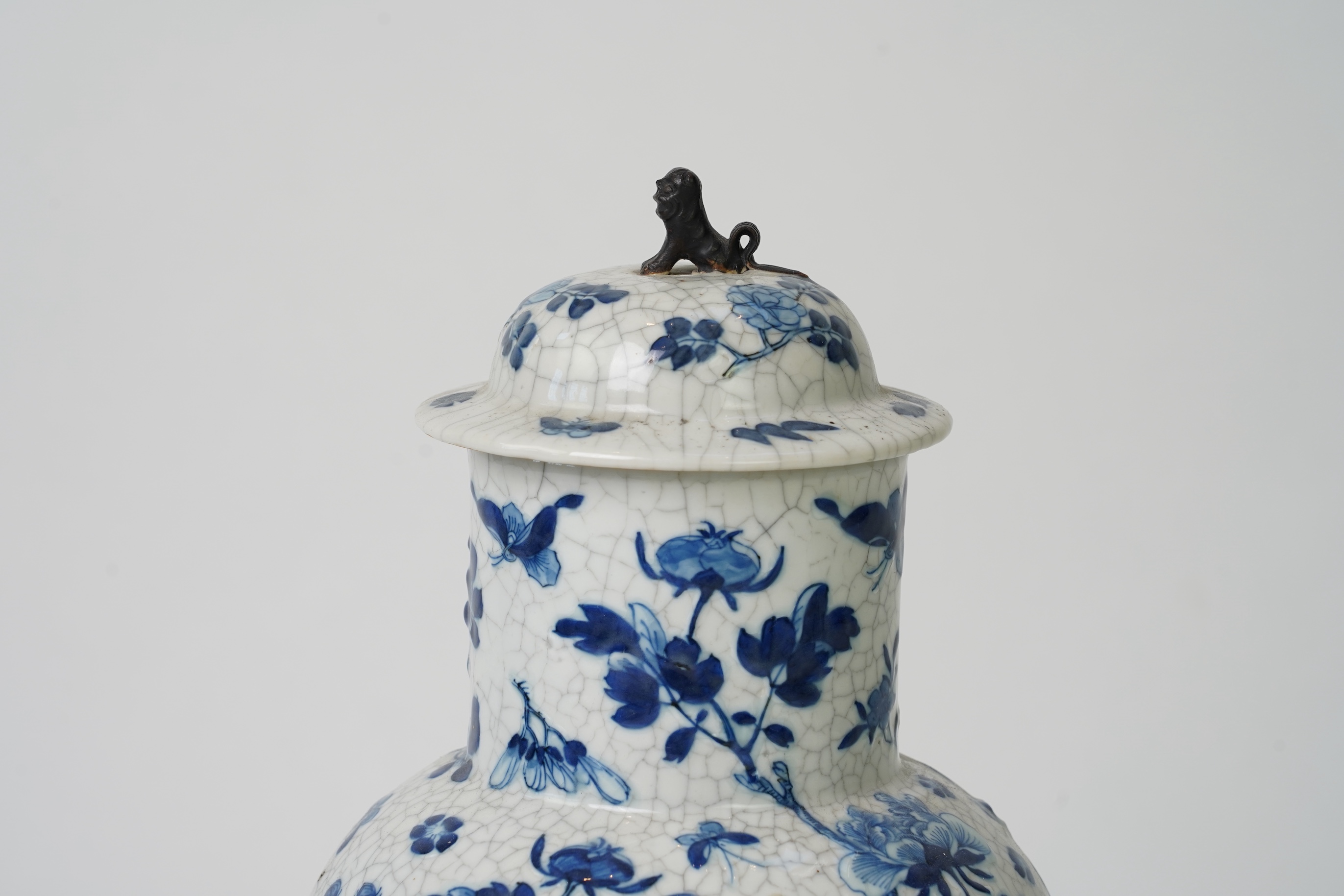 A Chinese blue and white crackle glaze baluster vase and cover, early 20th century